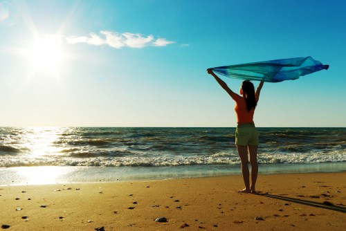 girl-woman-happy-sea-sun-beach-sand-sky