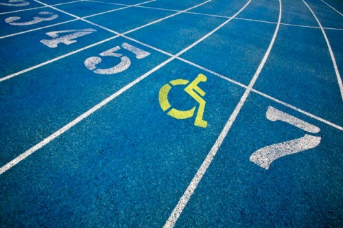 Handicap wheelchair icon superimposed on top of running track.